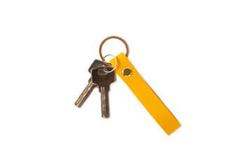 Leather keychain with key ring isolated on white background. Concepts for real estate and moving home or renting property. Buying a property. Mock-up keychain.Copy space.