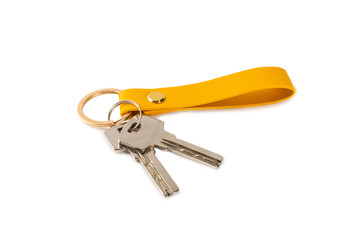 Leather keychain with key ring isolated on white background. Concepts for real estate and moving home or renting property. Buying a property. Mock-up keychain.Copy space.