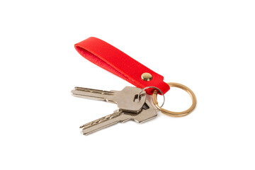 Leather keychain with key ring isolated on white background. Concepts for real estate and moving home or renting property. Buying a property. Mock-up keychain.Copy space.