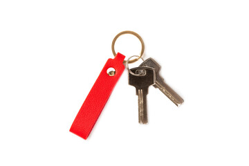 Leather keychain with key ring isolated on white background. Concepts for real estate and moving home or renting property. Buying a property. Mock-up keychain.Copy space.