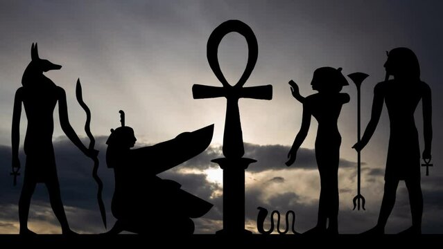Hieroglyphic with Key of Life, Time Lapse at Sunrise with Fast Clouds and Dark Silhouette of Egyptian Simbols