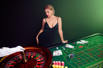 Photo of chic attractive girl playing casino look ball spinning in fortune wheel feel lucky winning