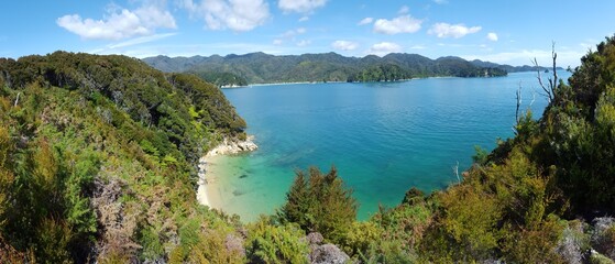 Fototapeta na wymiar New Zealand Abel Tasman blue and green sea water sky bushes