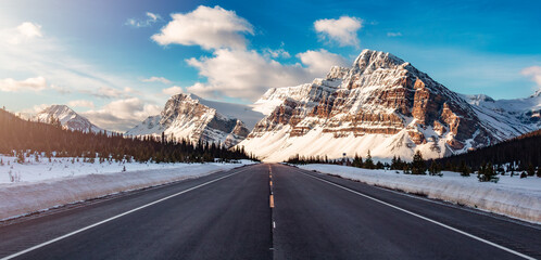 Road with Canadian Rocky Mountain Peaks Covered in Snow. Banff