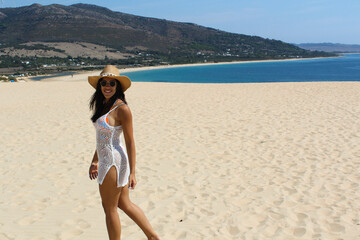 latin girl on the Tarifa beach in summer