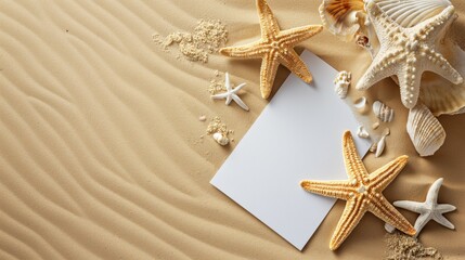 Sand background with sea stars and notepaper
