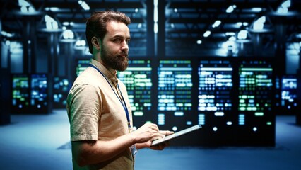 System administrator doing checkup on VPN servers with top security standards used to adequately protect sensitive data. High tech facility providing secure internet connections for clients