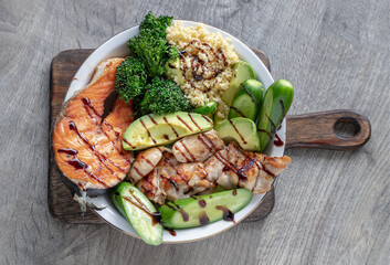 Breakfast is including Salmon steak, Chicken steak, Couscous, cut Avocado, Broccoli and cut...