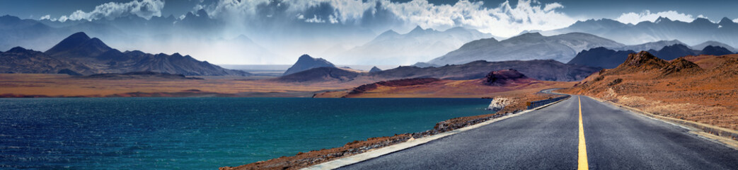 Empty road with mountains and sea coast