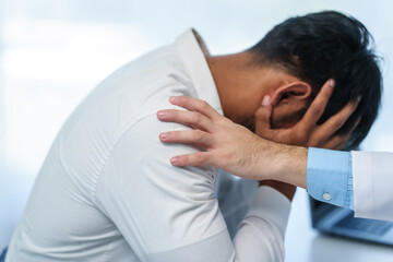 close-up of male patient consultation with doctor, explaining model of reproductive system,...