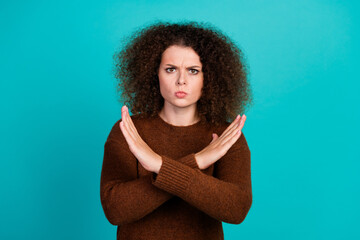 Portrait of gloomy caucasian girl in brown pullover she crossed arms having veto about marriage...