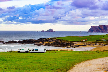 Naklejka premium Campervans on sea coast in Asturias Spain.