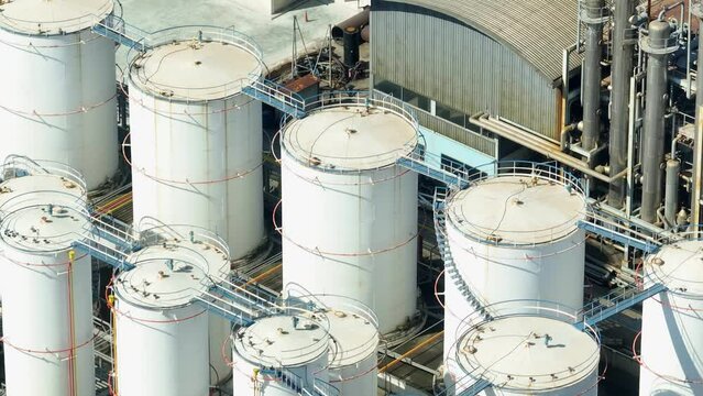 A diesel and biodiesel refinery, a modern alchemy lab where they transform raw materials into liquid gold - diesel and biodiesel, fuelling our vehicles and greening the planet. Aerial footage.