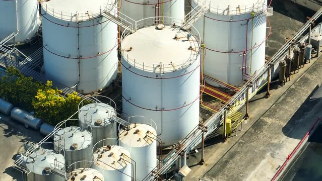 An advanced refinery specializing in converting renewable resources like vegetable oils into eco-friendly biodiesel, reducing carbon emissions and promoting sustainability. Aerial footage.