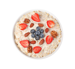 Tasty boiled oatmeal with berries and nuts in bowl isolated on white, top view