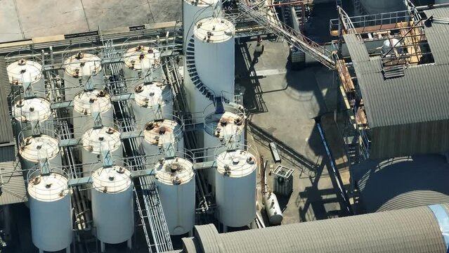 Utilizing cutting-edge technology, this refinery produces high-quality diesel, meeting strict environmental regulations and contributing to cleaner air. Heavy machinery and fluid concept. Drone view.
