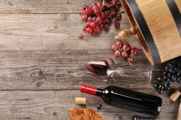 Winemaking. Flat lay composition with tasty wine and barrel on wooden table, space for text