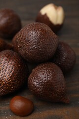 Fresh salak fruits on wooden table, closeup