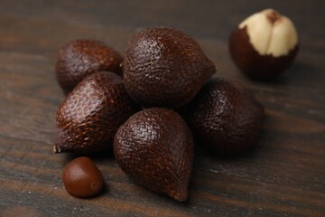 Fresh salak fruits on wooden table, closeup