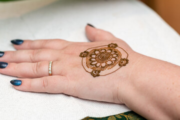 Woman's hand with henna tattoo. Bridal Mehndi.