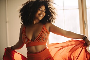 Joyful Woman Dancing in Sunlit Room with Flowing Red Fabric - obrazy, fototapety, plakaty