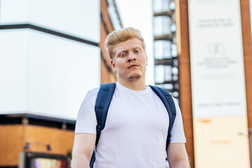Portrait of a young albino latin man in the city