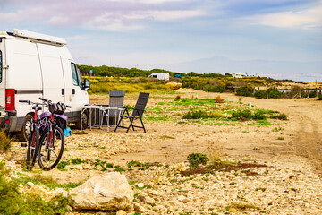 Campervan and bicycles camping on nature
