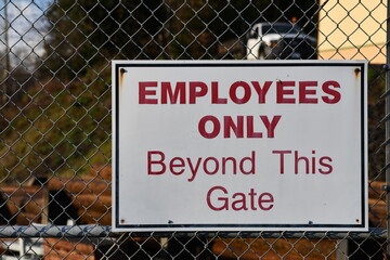 Employees only sign on gate. - obrazy, fototapety, plakaty