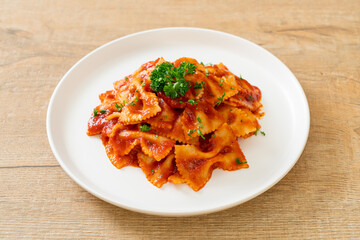 farfalle pasta in tomato sauce with parsley