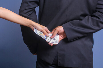 Man receiving bribe money from behind. Concept for corruption, bribery and crime