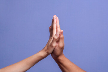 Two hands of people making high five gesture