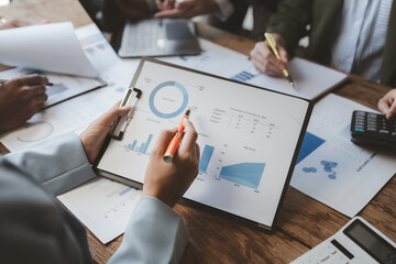 Team of analyst working on financial data analysis dashboard on paper as marketing indication for business strategic planning, Insight, They are calculating the taxes they have to pay,