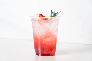 strawberry with soda in glass