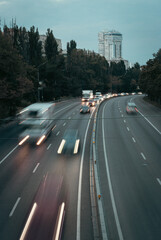 Traffic on highway, Kyiv, Ukraine. Traffic jam in evening city. Kyiv cityscape. Cars in motion, high angle view. Urban scene with transport. City street full of cars. Rush hour in the city. 