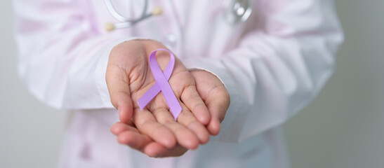 Doctor with purple ribbon for world cancer day, lupus, Pancreatic, Esophageal, Testicular cancer,...