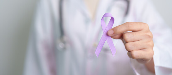 Doctor with purple ribbon for world cancer day, lupus, Pancreatic, Esophageal, Testicular cancer,...
