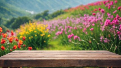 Flowers on a table, Flowers in the mountains, Empty wood table top on blur abstract green from the garden. For the montage product display, a wooden table with a garden