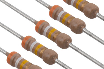 Electronic resistors texture isolated on white background. Carbon film resistors isolated. Macro shot various electronic components © Aleksei