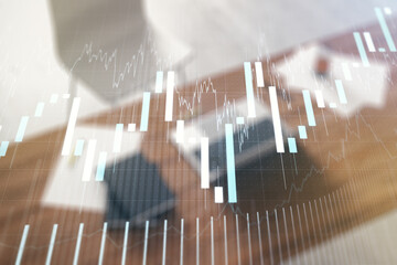 Abstract creative financial graph and modern desktop with pc on background, financial and trading...