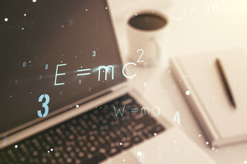 Double exposure of creative scientific formula concept on laptop background, research and...