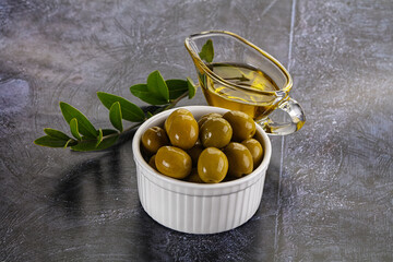 Ripe tasty green olives with branch