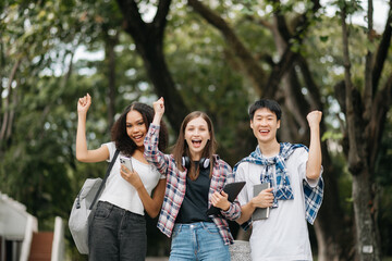 Young college students and a female student group work at the campus park
