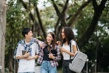 Young college students and a female student group work at the campus park