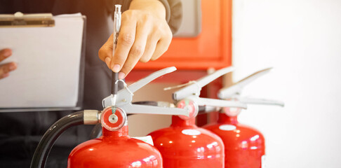 Engineer check fire suppression system,check fire extinguisher tank in the fire control room for...