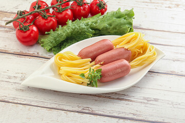 Mini sausages with pasta spaghetti