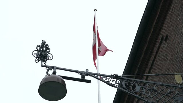 Denmark red flag with shop craftwork metal signage