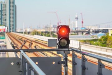 Railway traffic light in the area of a train station.
