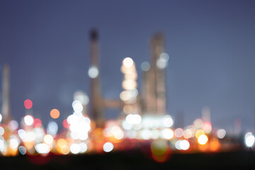 Abstract blur bokeh of oil gas refinery plant. May called petroleum, production or petrochemical plant. Industrial factory and engineering technology at night for business of power energy background.