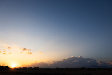 Beautiful sky and cloud at high. Landscape include space, light of nature, sunset, sunrise, horizon or skyline. Colorful with yellow, orange and blue at evening in autumn for background and wallpaper.