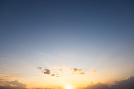 Beautiful sky and cloud at high. Include space, light of nature, sunset, sunrise. Colorful with yellow, orange and blue color at evening time in autumn for scene, backdrop, background and wallpaper.